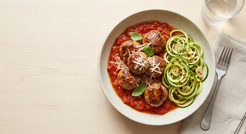 Pan-Seared Turkey Meatballs with Rustic Marinara and Garlicky Zucchini Noodles
