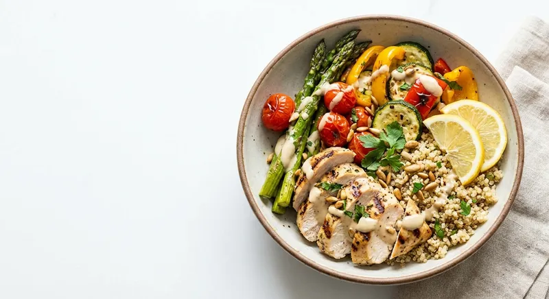 Grilled Lemon-Chicken Quinoa Bowl with Roasted Vegetables & Tahini-Lemon Dressing