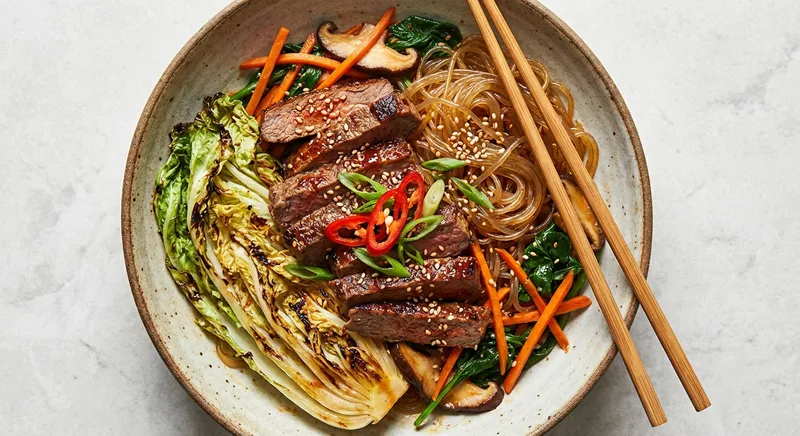 Korean-Style Beef & Sweet Potato Glass Noodle Stir‑Fry with Gochujang‑Charred Napa Cabbage